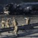 Russian, Ukrainian troops fight block by block in key city