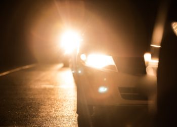 Police Cracking Whip On Vehicles With High Beam Headlamps